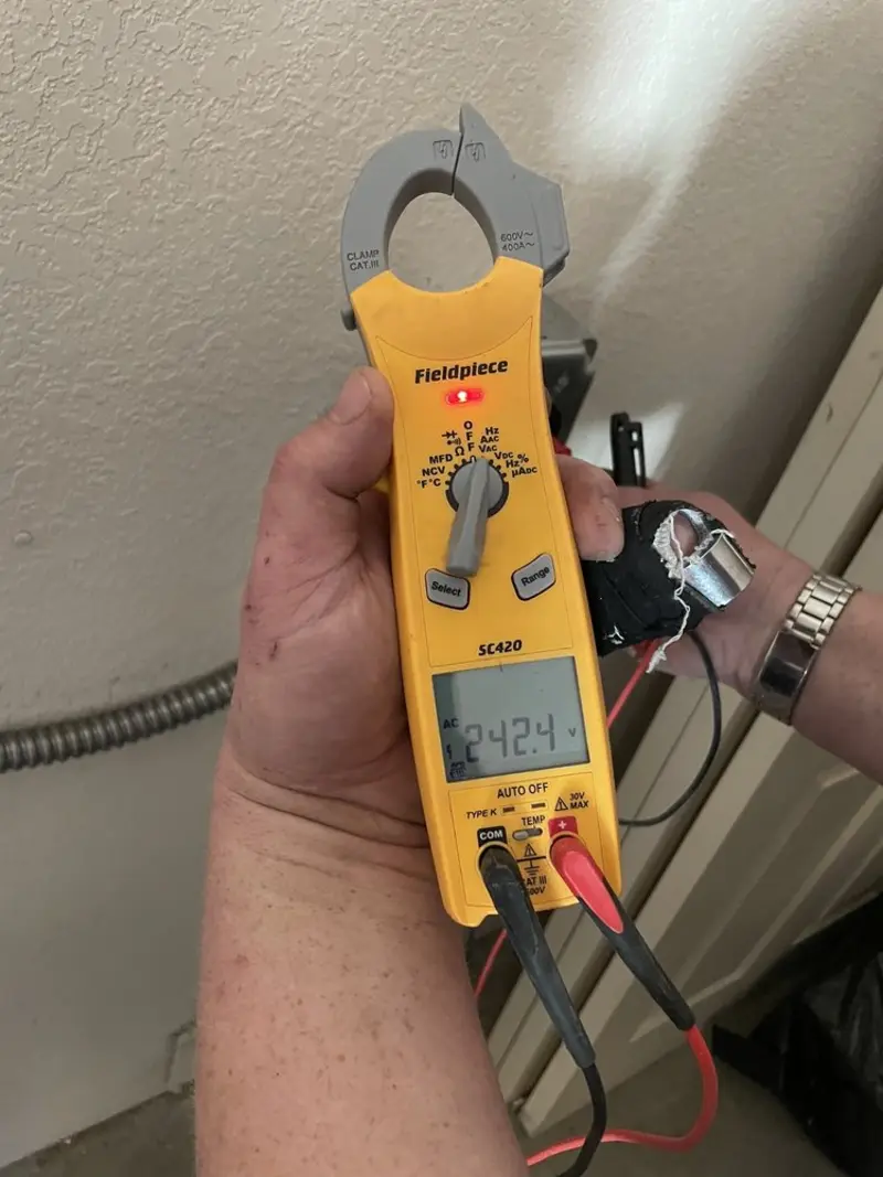 Voltage testing with clamp meter during Aluminum Wiring Replacement in Bedford